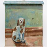 A small biscuit box painted on one side is a dog ornament.